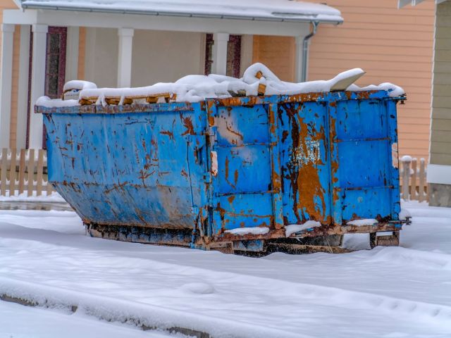 weather-worn-dumpster-falling-over-from-snow - Dumpster Rental Systems dumpster left in the snow with improper weatherproofing and storage